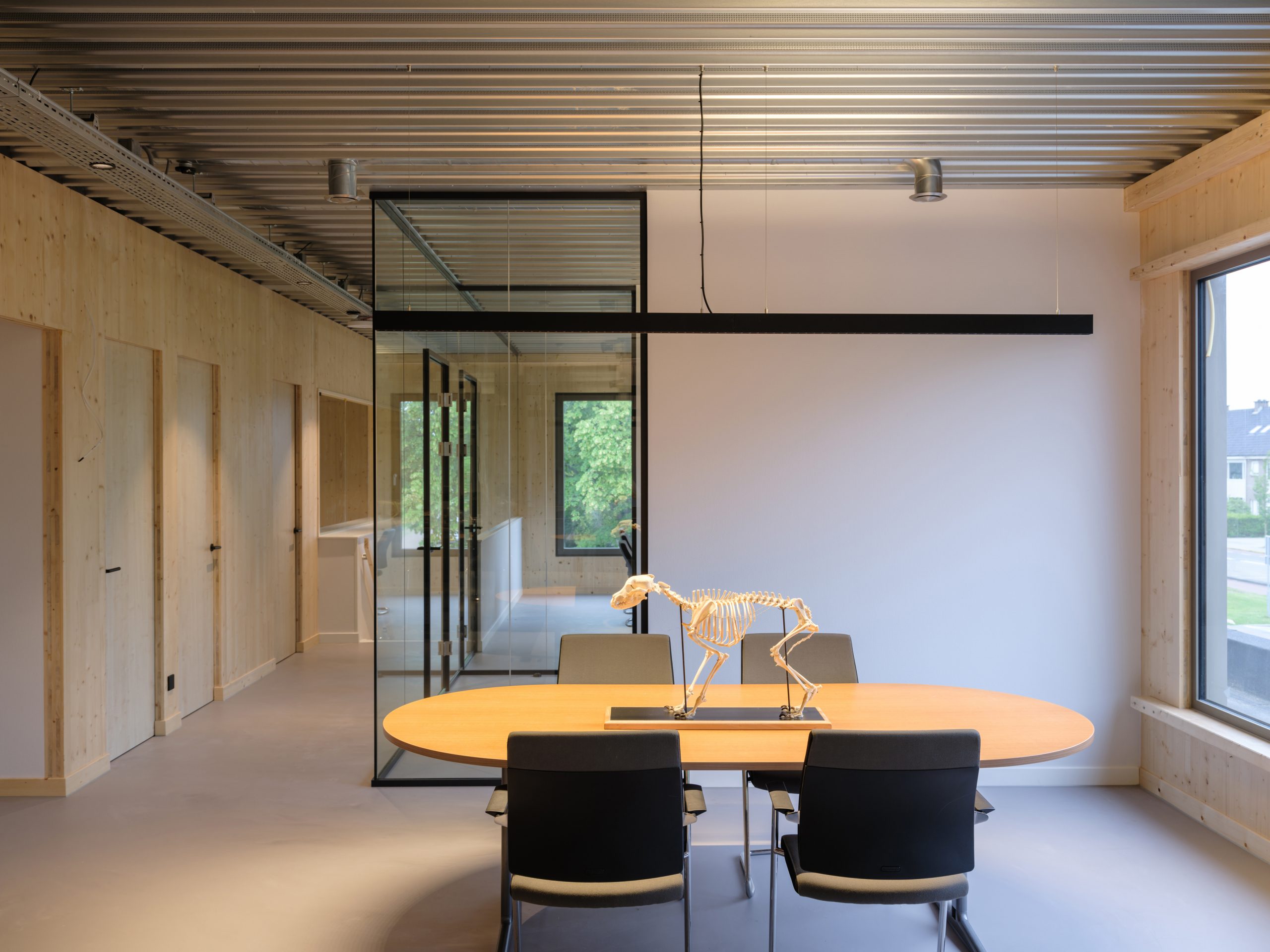 Meeting room CLT wood black table_wooden wall_galvanized steel_big windows_by MOST Architecture