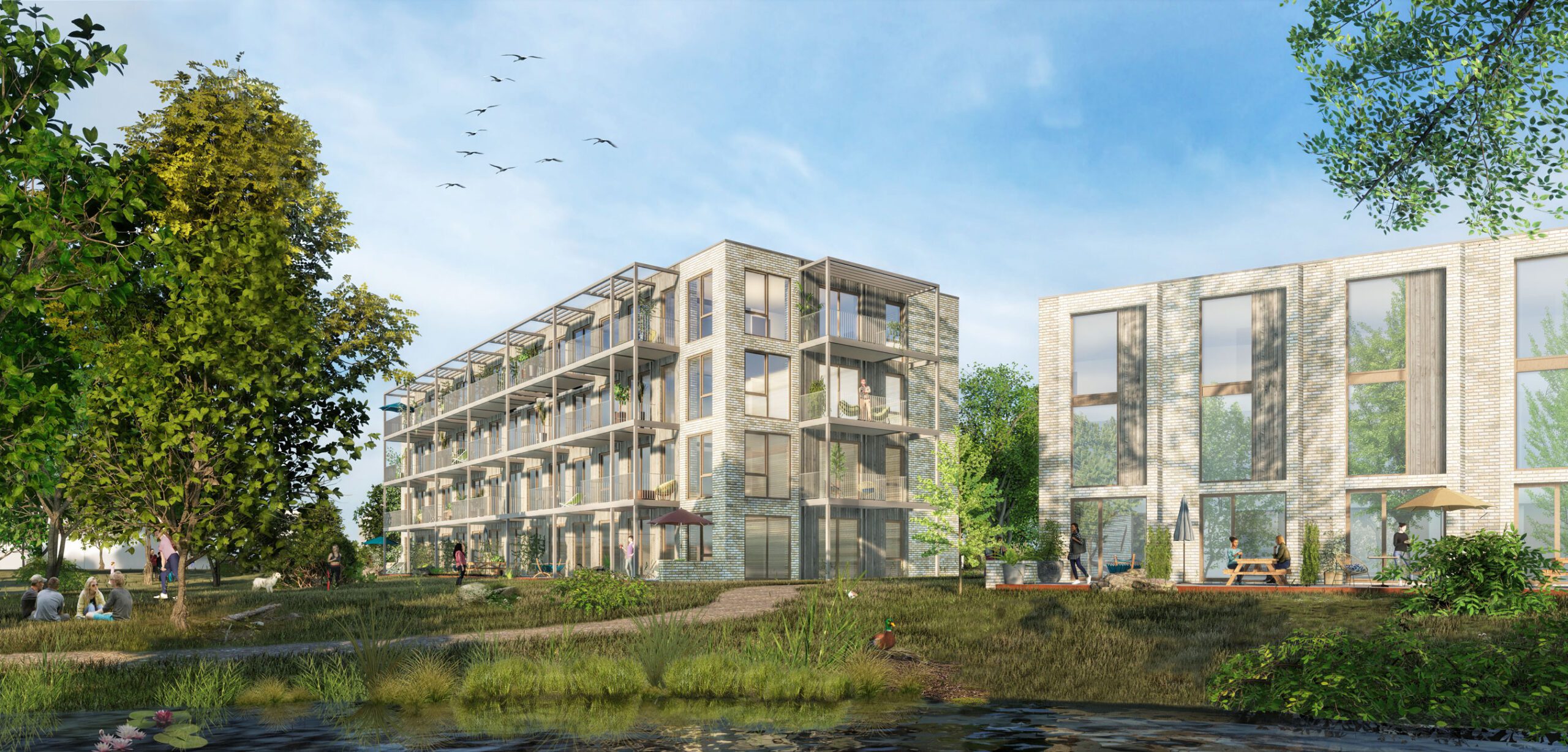 The serene overview of the entire houding complex in Leusden, featuring a peaceful park perfect for summer enjoyment right at the doorstep, designed by MOST Architecture + TOMDAVID Architecten.