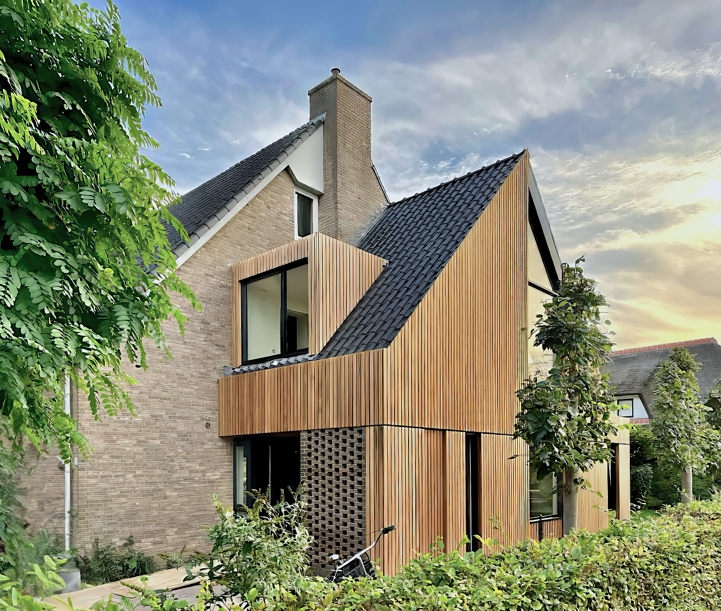 The double-story extension expands the living space and adds an extra bedroom with a great view over the landscape, designed by MOST Architecture.